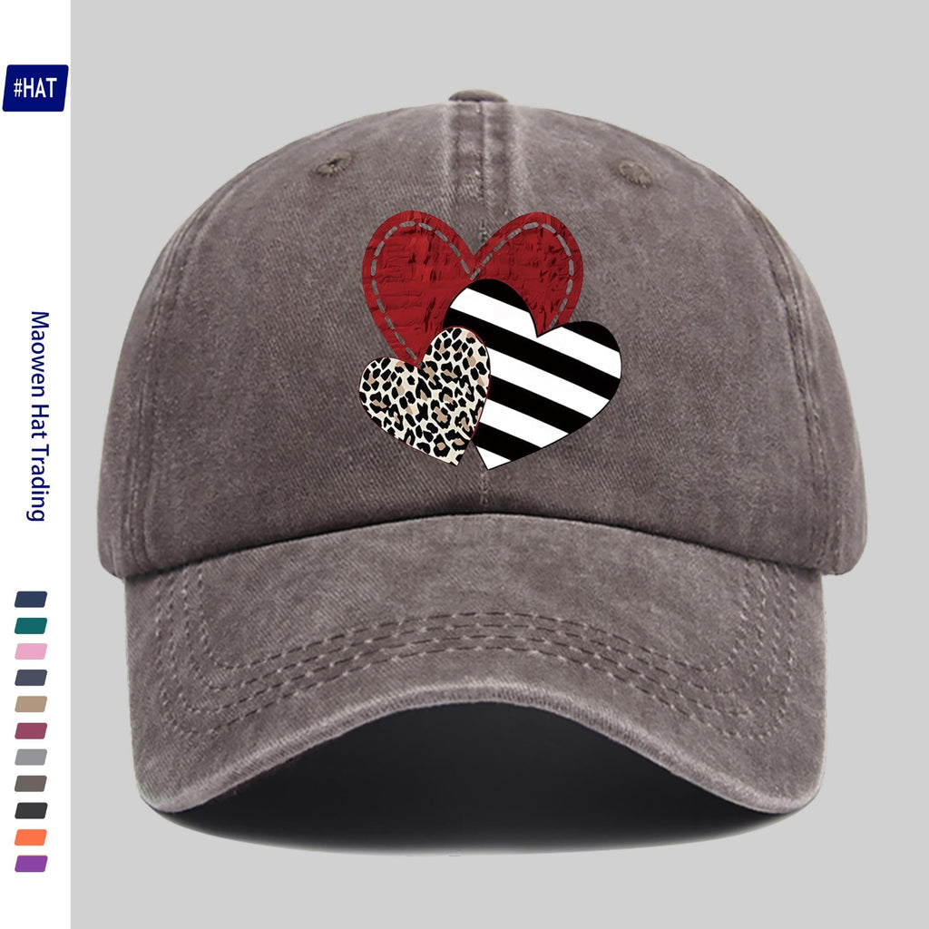 A Washed Baseball Cap with Iron-on Transfer Designs of Red Hearts, Black Striped Hearts, Leopard Print Hearts, and Crossed Hearts. It Features a New Autumn/winter Vintage Style, Is Unisex, Adjustable in Size, Lightweight, and Suitable for Outdoor Use
