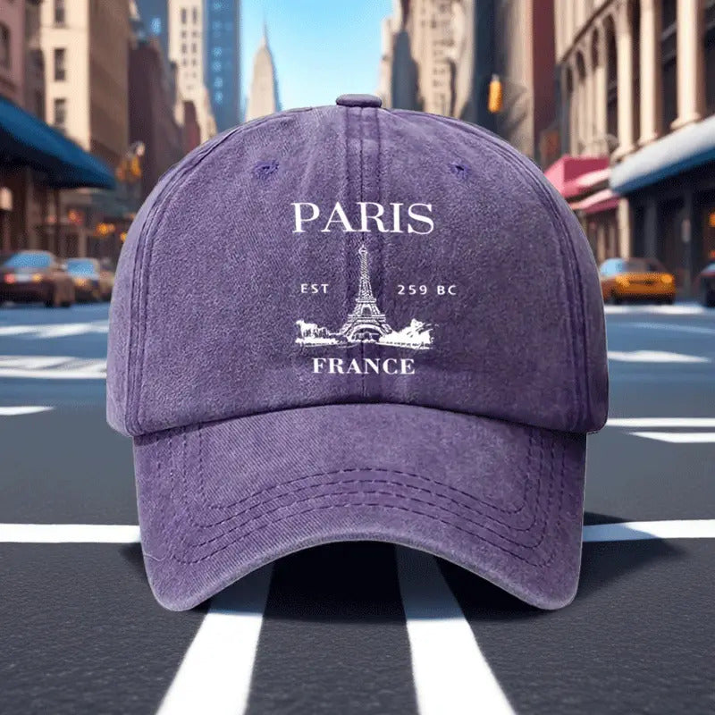 A Retro Baseball Cap Featuring a Print of The Eiffel Tower in Paris, Designed with a Relaxed Curved Brim And Soft Top, Adjustable for a Comfortable Fit, Perfect for Sports, And Stylish with a Pointed Top